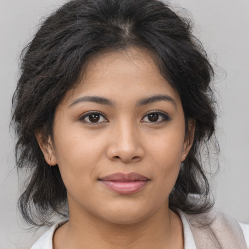 Joyful asian young-adult female with medium  brown hair and brown eyes