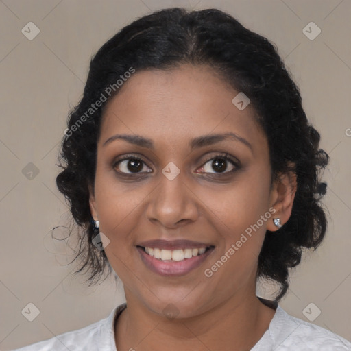 Joyful black young-adult female with medium  brown hair and brown eyes