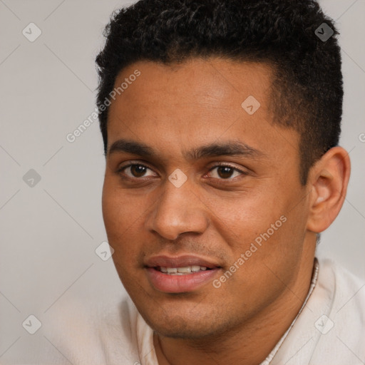 Joyful black young-adult male with short  black hair and brown eyes