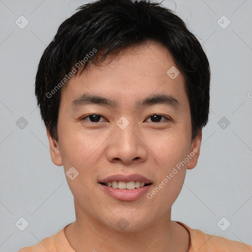 Joyful asian young-adult male with short  black hair and brown eyes