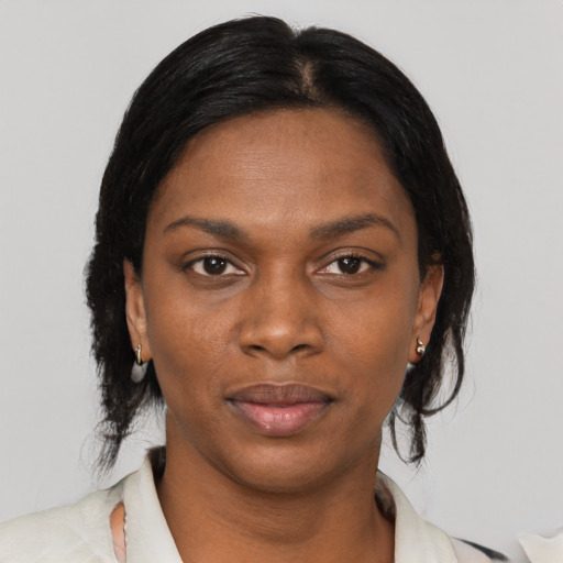 Neutral black adult female with medium  black hair and brown eyes