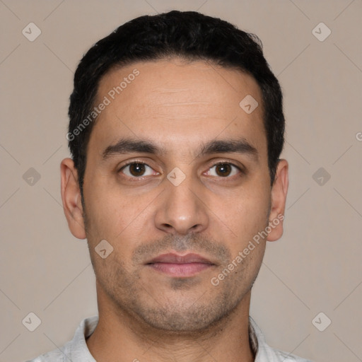 Neutral white young-adult male with short  black hair and brown eyes
