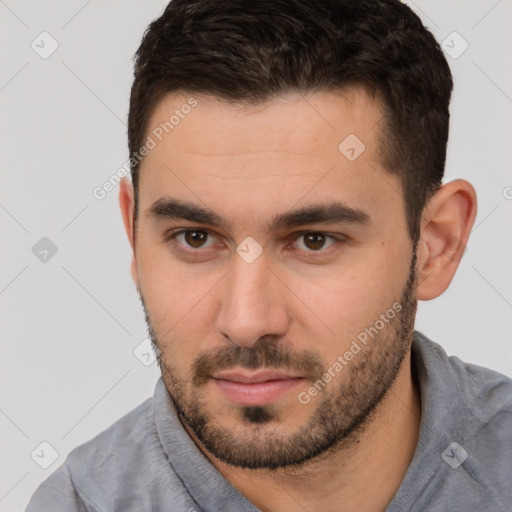 Neutral white young-adult male with short  brown hair and brown eyes