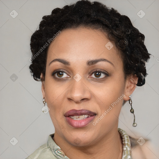 Joyful black adult female with short  brown hair and brown eyes