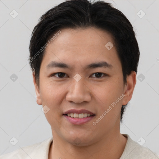 Joyful asian young-adult male with short  brown hair and brown eyes