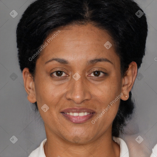 Joyful black adult female with short  brown hair and brown eyes