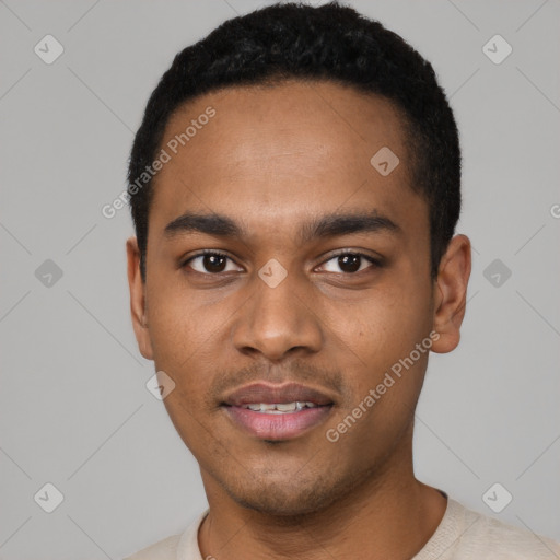 Joyful black young-adult male with short  black hair and brown eyes