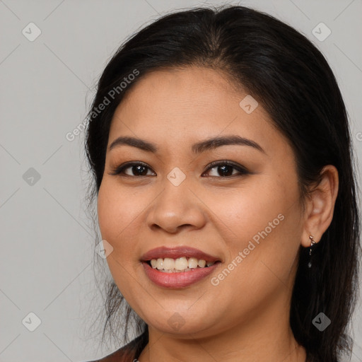 Joyful latino young-adult female with long  brown hair and brown eyes