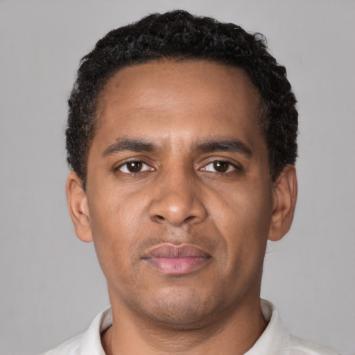 Neutral black young-adult male with short  brown hair and brown eyes