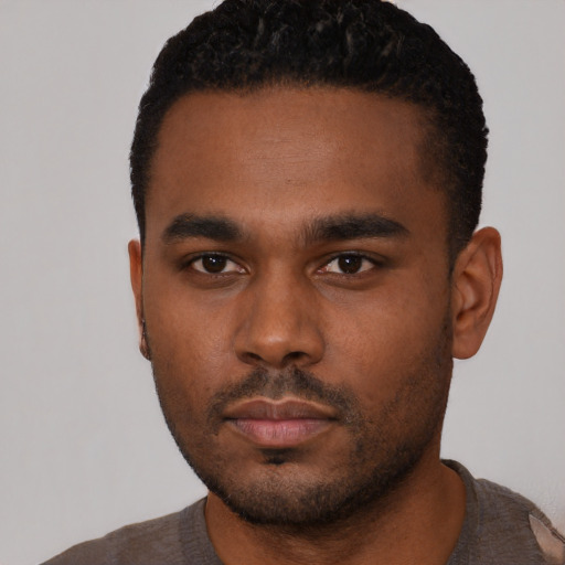 Neutral black young-adult male with short  black hair and brown eyes