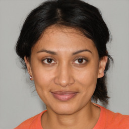 Joyful white young-adult female with medium  brown hair and brown eyes