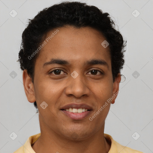 Joyful latino young-adult male with short  brown hair and brown eyes