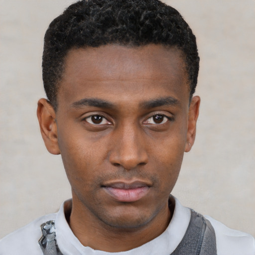 Neutral black young-adult male with short  black hair and brown eyes
