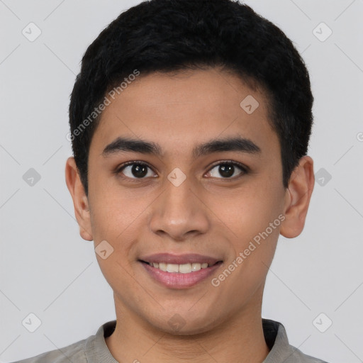 Joyful latino young-adult male with short  black hair and brown eyes