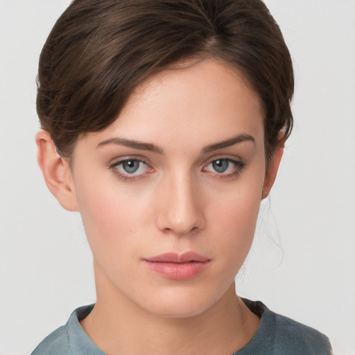 Neutral white young-adult female with short  brown hair and grey eyes