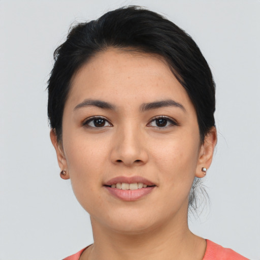 Joyful asian young-adult female with short  black hair and brown eyes