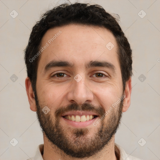 Joyful white young-adult male with short  black hair and brown eyes