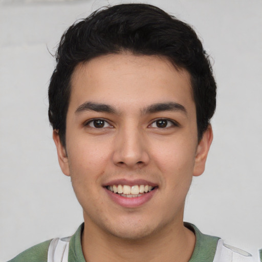 Joyful asian young-adult male with short  black hair and brown eyes