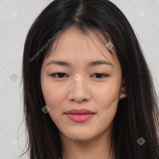 Joyful asian young-adult female with long  brown hair and brown eyes