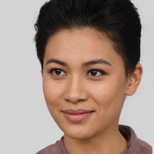 Joyful asian young-adult female with short  brown hair and brown eyes