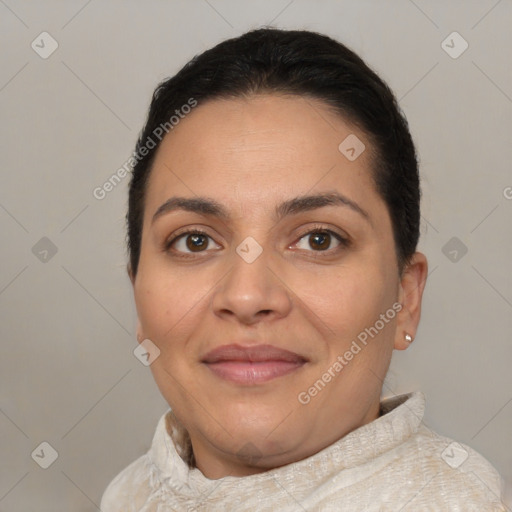 Joyful latino young-adult female with short  brown hair and brown eyes