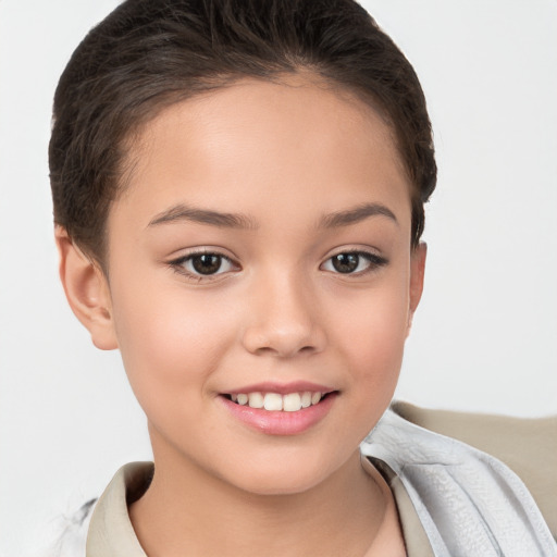 Joyful white child female with short  brown hair and brown eyes