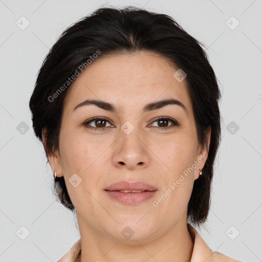 Joyful asian adult female with medium  brown hair and brown eyes