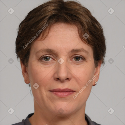 Joyful white adult female with short  brown hair and grey eyes