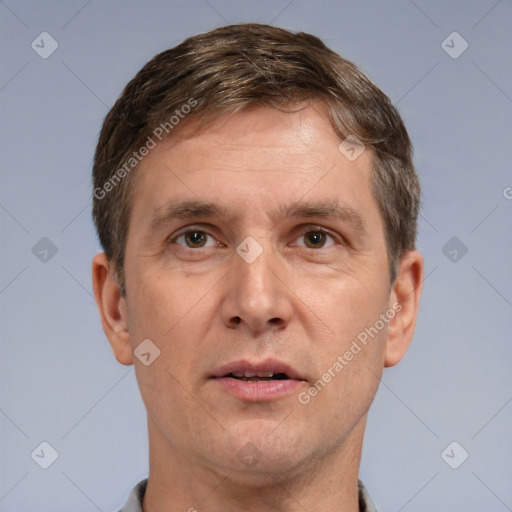 Joyful white adult male with short  brown hair and grey eyes