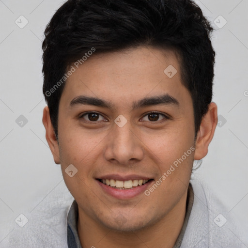 Joyful latino young-adult male with short  brown hair and brown eyes