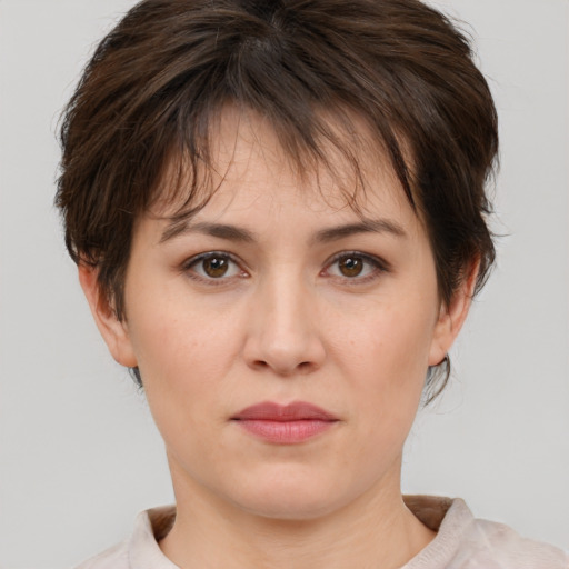 Neutral white young-adult female with short  brown hair and brown eyes