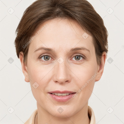 Joyful white young-adult female with short  brown hair and grey eyes