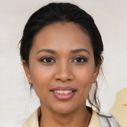 Joyful white young-adult female with medium  brown hair and brown eyes