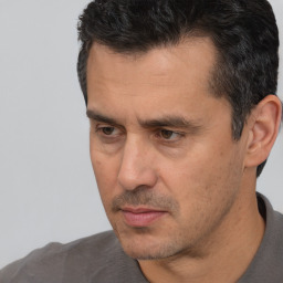 Neutral white adult male with short  black hair and brown eyes