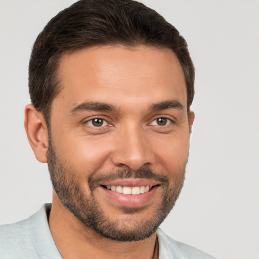 Joyful white young-adult male with short  brown hair and brown eyes