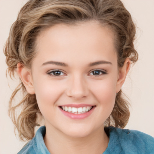 Joyful white child female with medium  brown hair and grey eyes