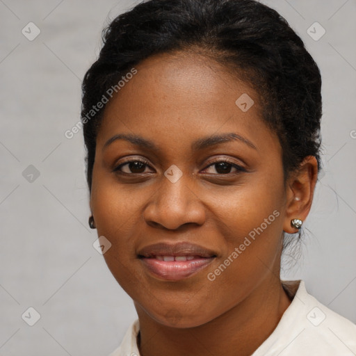 Joyful black young-adult female with short  black hair and brown eyes