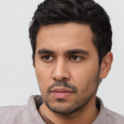 Neutral latino young-adult male with short  black hair and brown eyes