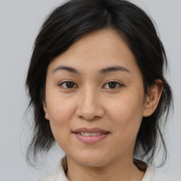 Joyful asian adult female with medium  brown hair and brown eyes