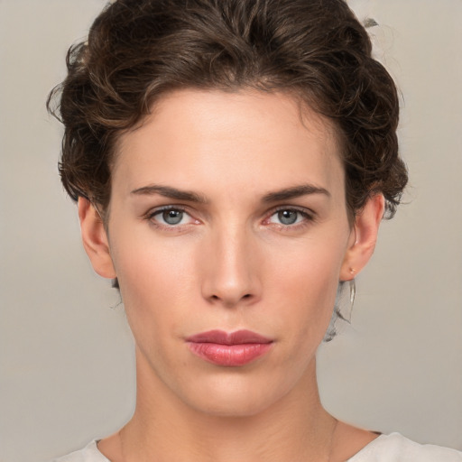 Neutral white young-adult female with short  brown hair and brown eyes