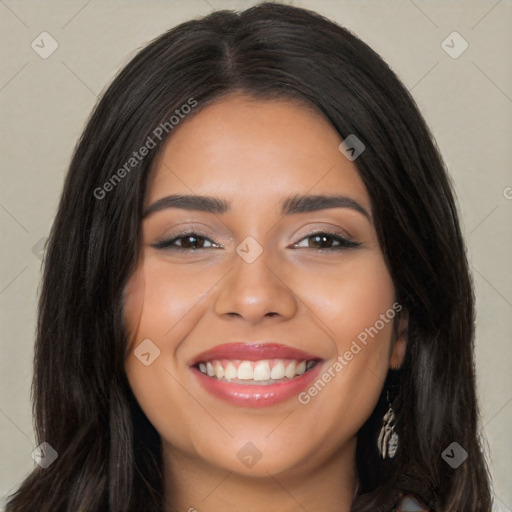 Joyful latino young-adult female with long  brown hair and brown eyes