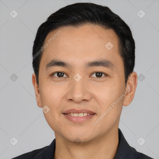 Joyful white young-adult male with short  black hair and brown eyes