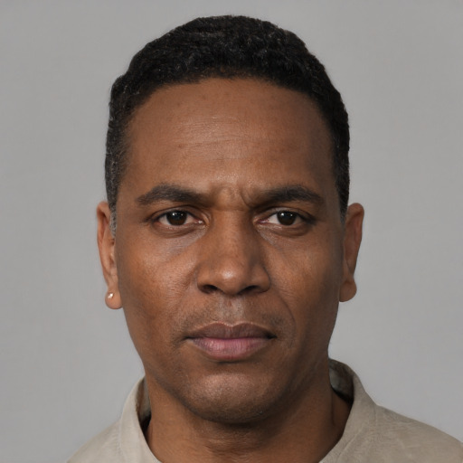 Neutral black adult male with short  black hair and brown eyes