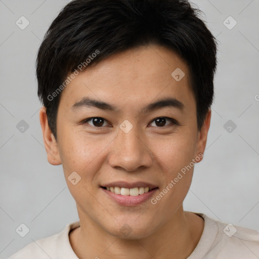 Joyful asian young-adult male with short  brown hair and brown eyes