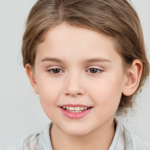 Joyful white child female with medium  brown hair and brown eyes