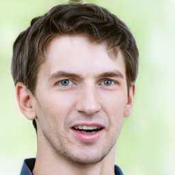 Joyful white young-adult male with short  brown hair and grey eyes