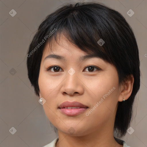 Joyful asian young-adult female with medium  brown hair and brown eyes