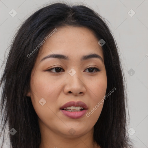 Joyful asian young-adult female with long  brown hair and brown eyes