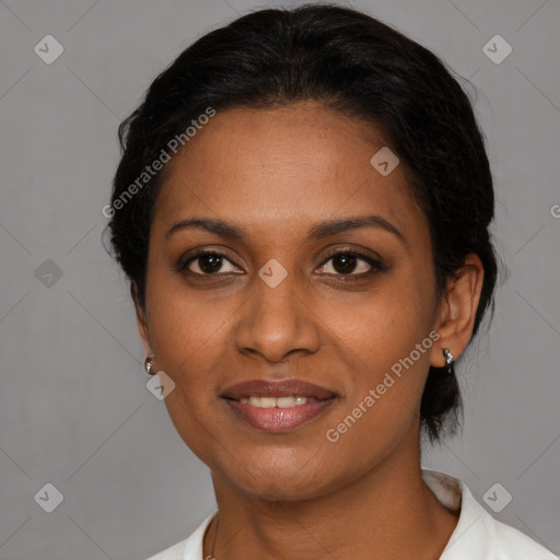 Joyful black young-adult female with medium  brown hair and brown eyes