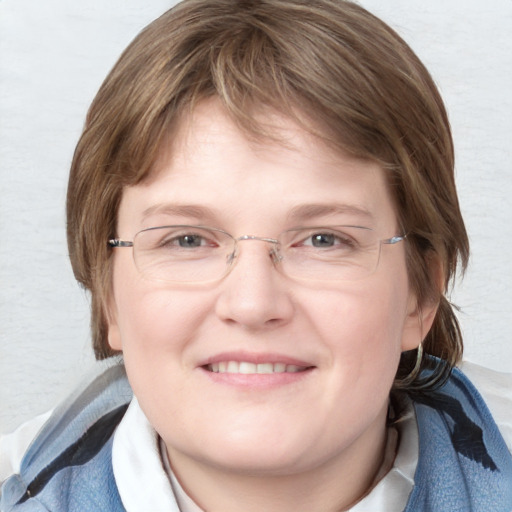 Joyful white young-adult female with medium  brown hair and blue eyes